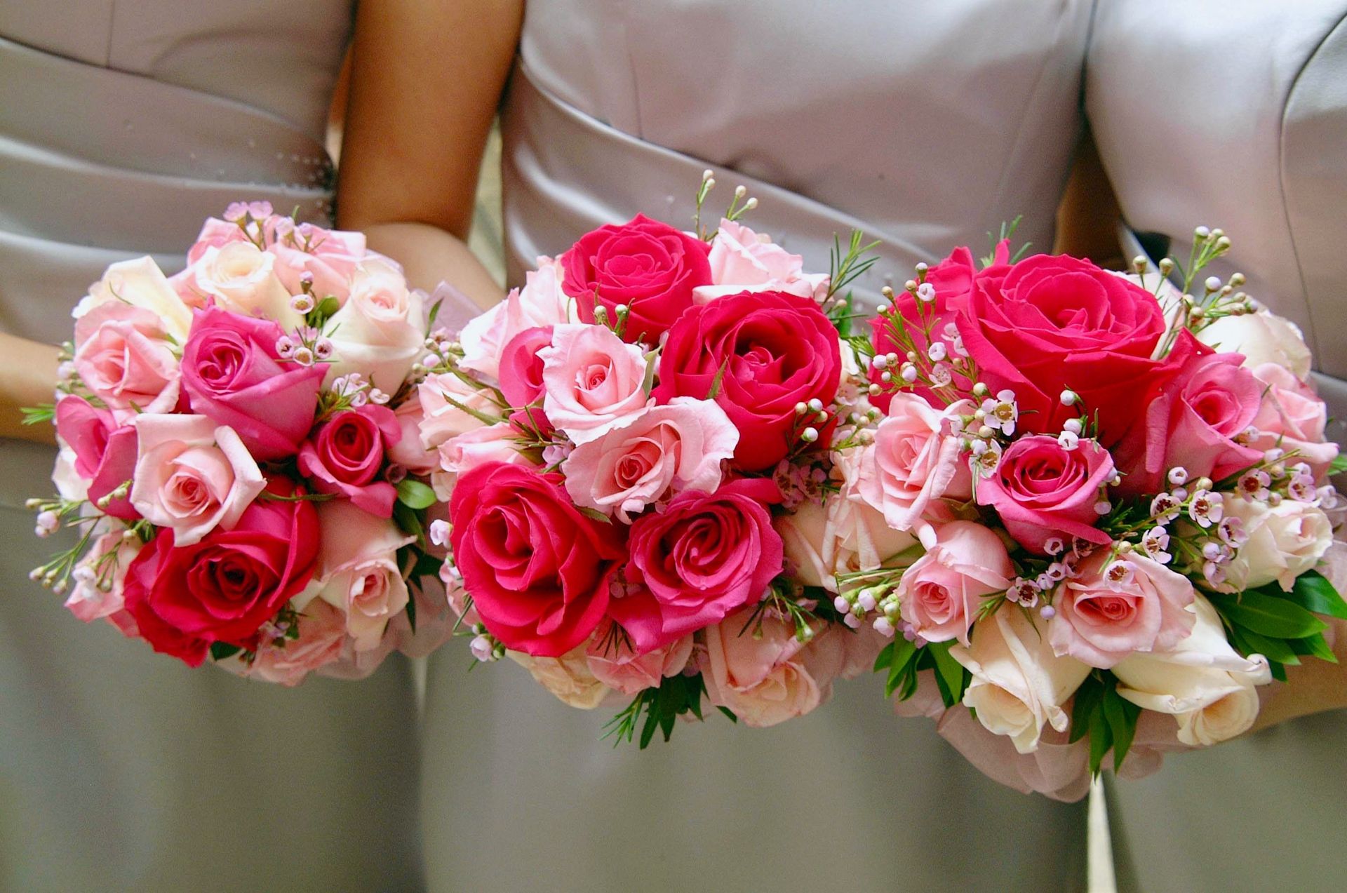 Beautiful bridal bouquets featuring pink and red roses, ideal for weddings and celebrations.